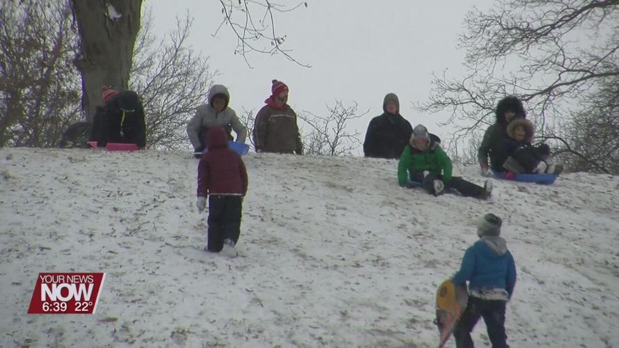 A Sunday blast of snow puts plows and sleds to work