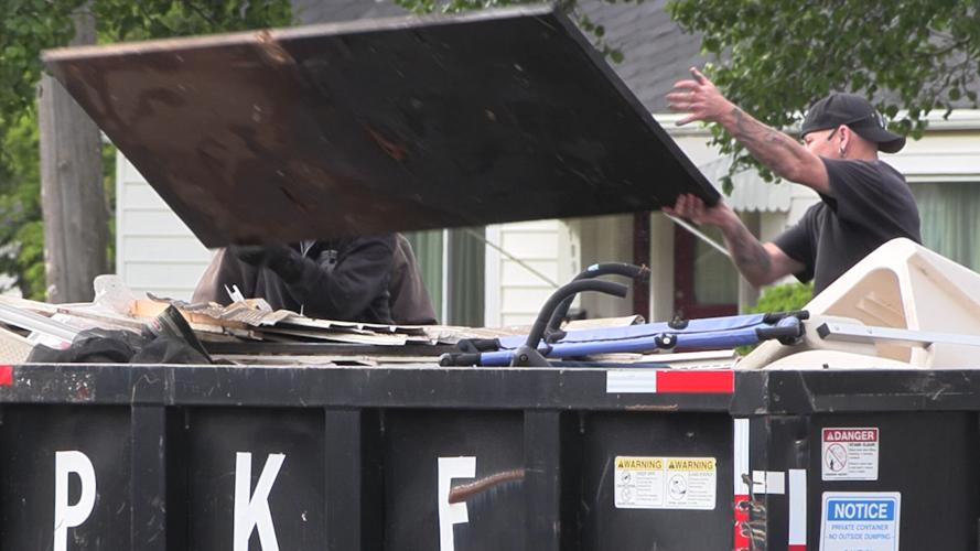 Volunteers help residents clear clutter during Mayor’s Spring Cleanup in Lima