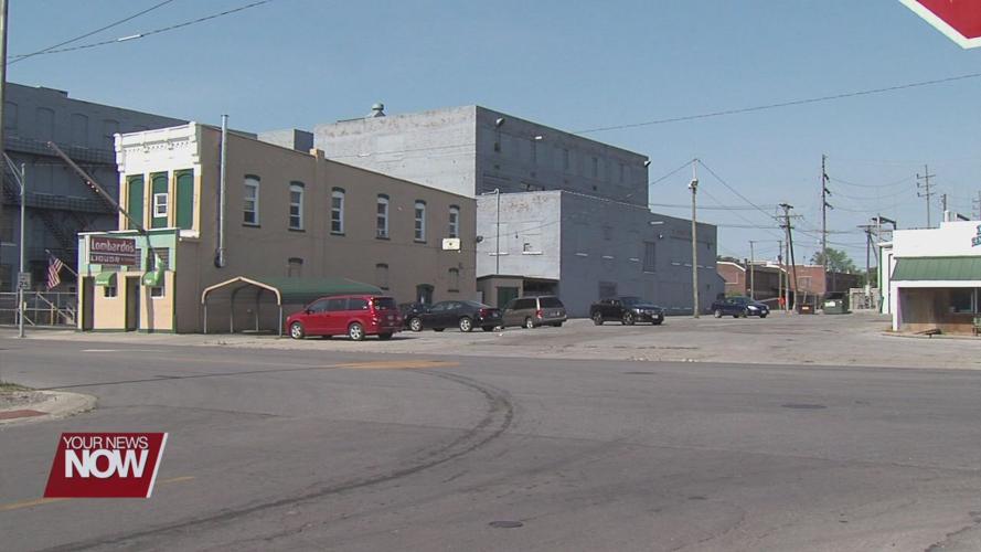 Two people charged, and two officers injured in an incident outside a Lima bar