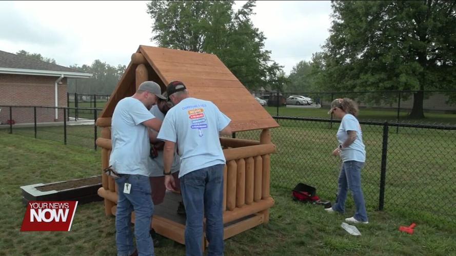 Local volunteers construct new playhouse for Head Start children