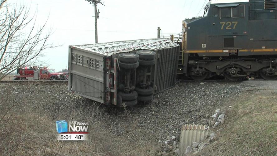 Semi hauling livestock gets stuck on tracks and hit by train 1.jpg