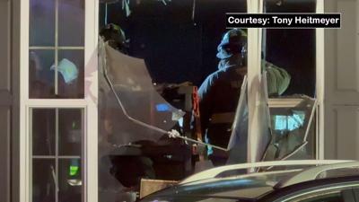 Man hospitalized after being pulled from burning trailer in Logan County