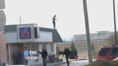Man threatens to jump off motel roof