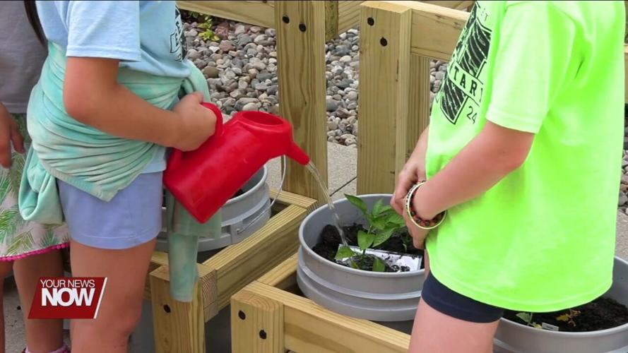 St. Paul Church of Christ in Wapakoneta teaching kids about food with garden bucket project while a site for the Ohio Summer Lunch Program