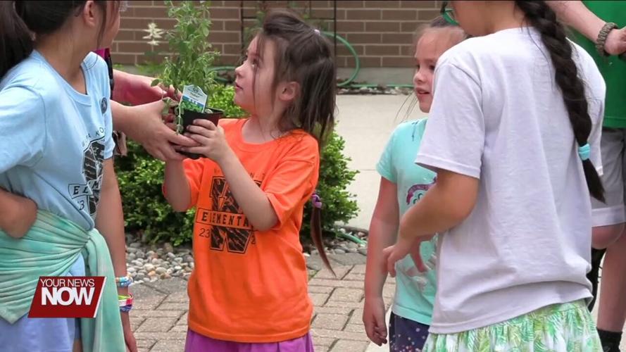 St. Paul Church of Christ in Wapakoneta teaching kids about food with garden bucket project while a site for the Ohio Summer Lunch Program