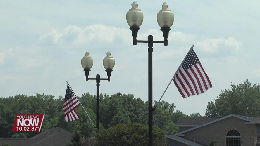 Monticello Subdivision donates to hang American flags on each lamp post