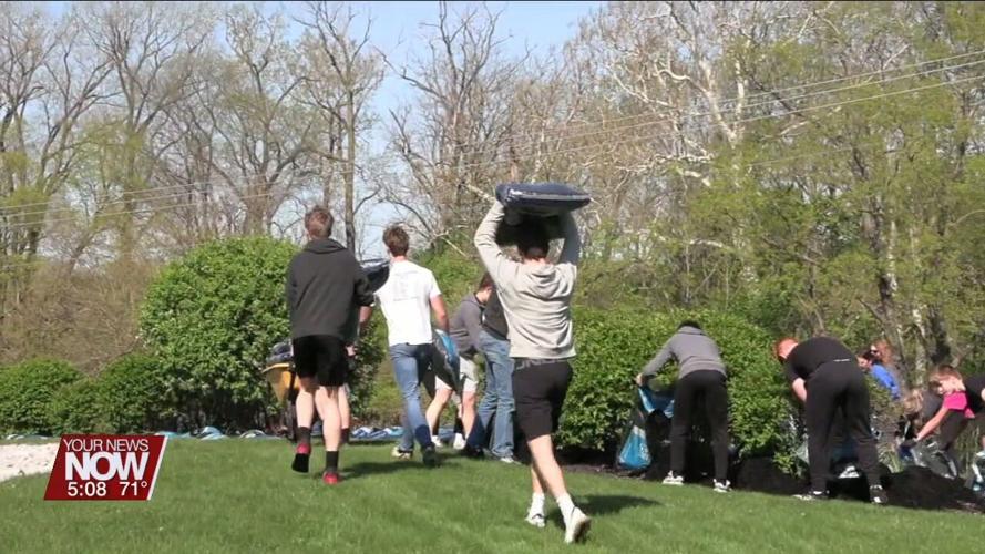 Delphos St. John's students spread mulch at Nutrien after the company purchases 1,100 bags during fundraiser