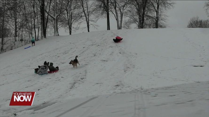 Area kids break out the sleds for some winter fun at Faurot Park