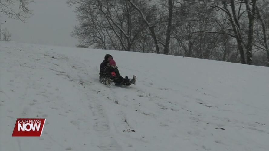 Area kids break out the sleds for some winter fun at Faurot Park