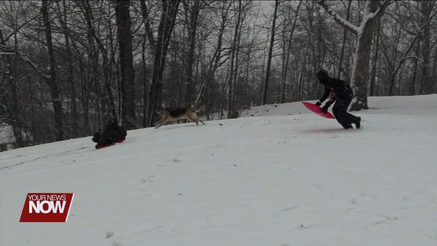 Area kids break out the sleds for some winter fun at Faurot Park