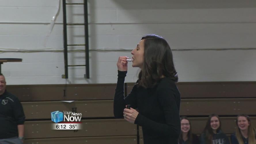 Teachers at Temple Christian Schools kiss a pig for a cause