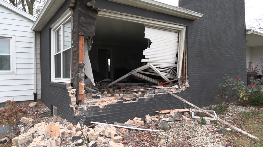 Jeep crashes into W. Elm Street home