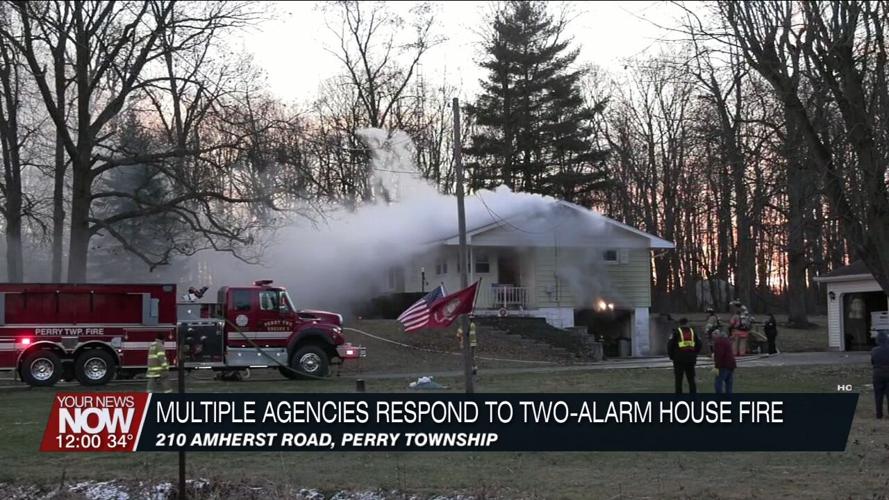 Multiple departments battle a two-alarm residential fire on Amherst Road