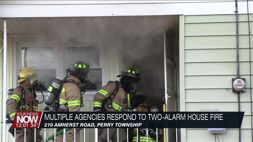 Multiple departments battle a two-alarm residential fire on Amherst Road