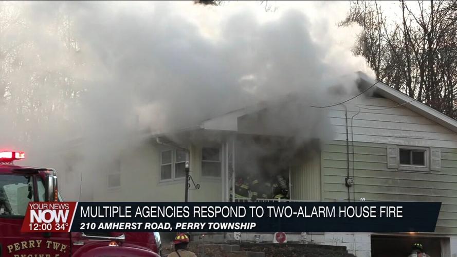Multiple departments battle a two-alarm residential fire on Amherst Road