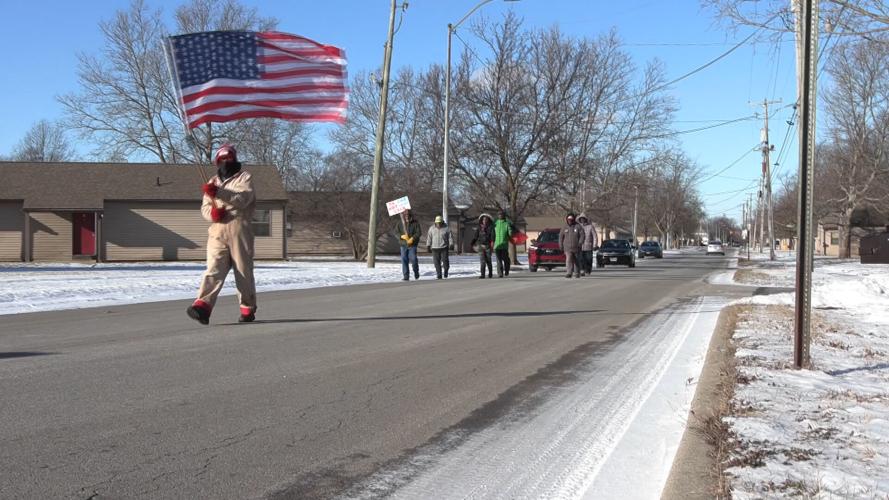 Residents brave the cold to march for MLK holiday