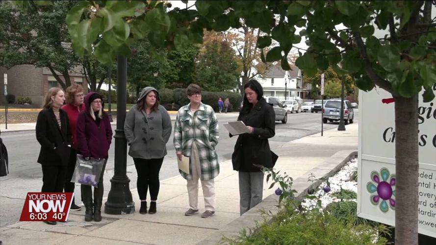 Crossroads Crisis Center honors domestic violence victims with planting of a purple butterfly bush
