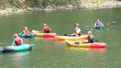 Campers go on a kayak adventure with the Johnny Appleseed Metropolitan Park District