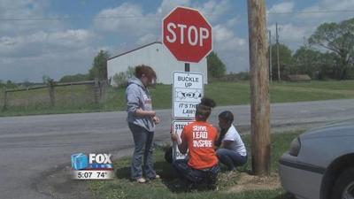Perry High School S.A.D.D. students post anti-distracted driving signs
