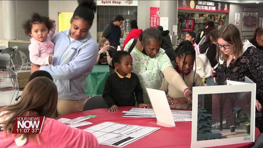 Early education students practice teaching at Holiday Family Learning Night