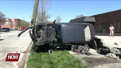 Woman injured after car crashes into utility pole on Main Street