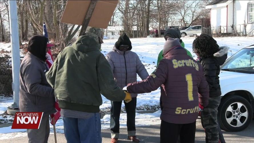 Residents brave the cold to march for MLK holiday