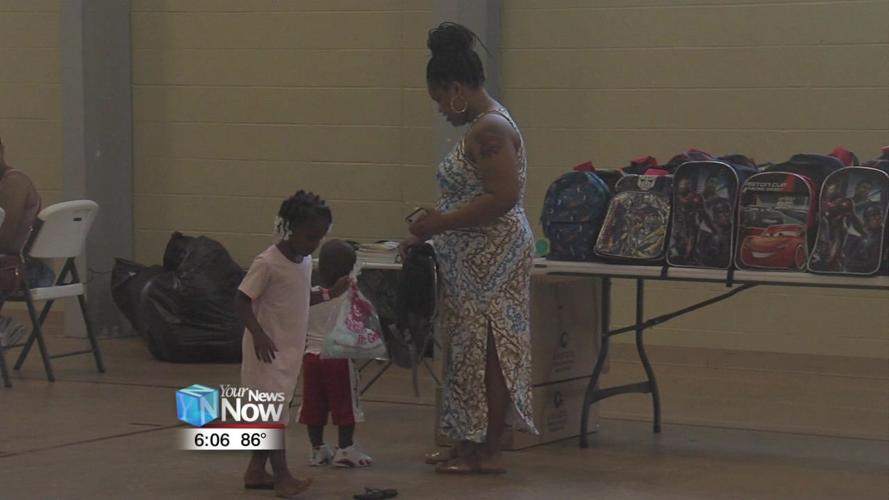 Lima church hands out 200 backpacks filled with school supplies.jpg