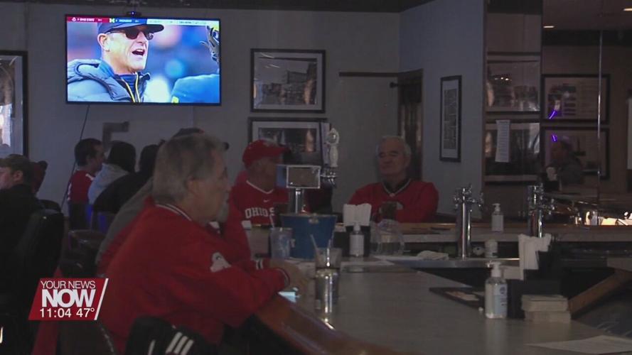 Lima residents gather to watch The Game and show their scarlet and grey pride