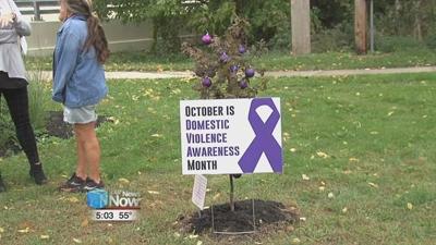 Crossroads plants trees for 19th year in honor of Domestic Violence Awareness Month