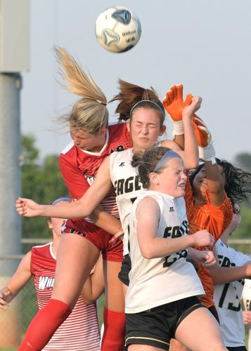 Wheatmore players go up for a header