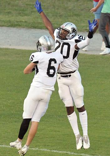 Ledford's Cameron Walker celebrates with Chase Tussey