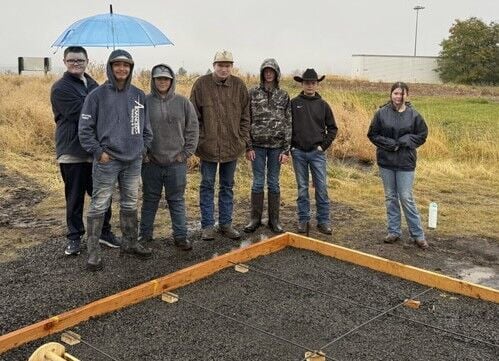 Students work on track and field concrete pad; thanks to community ...