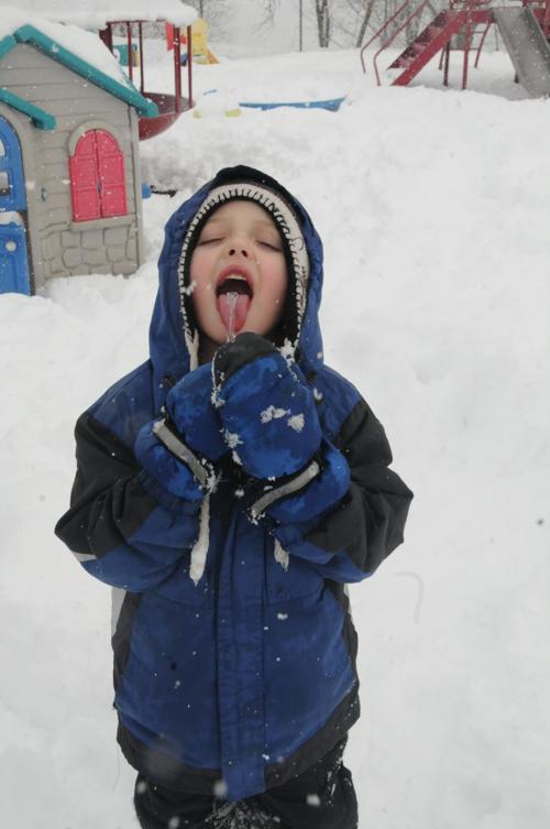 Russell Newson, 5, enjoys an icicle