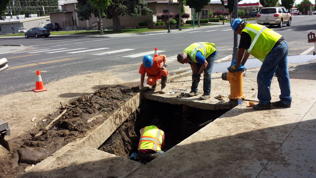 Ephrata Public Work crew repairs leaking water pipe on Basin Street ...