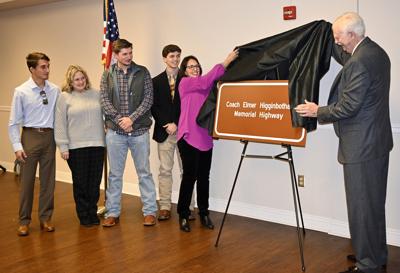 unveiling of sign indoors with mary michelle sons and commissioner tom king small.jpg