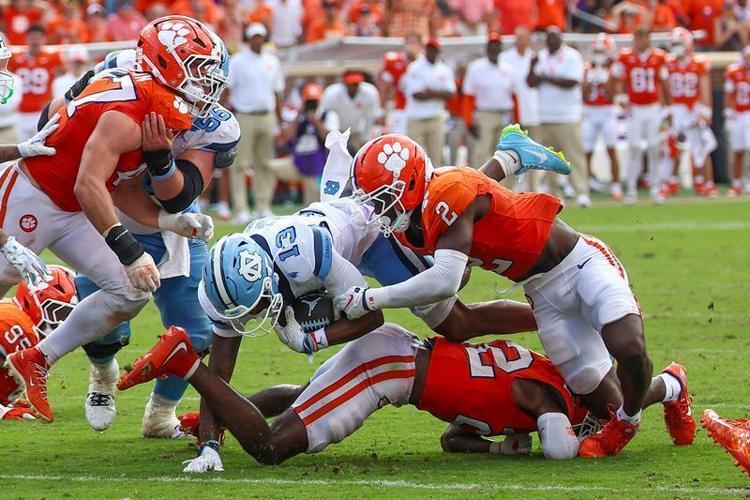 Sep 19, 2026; Clemson, South Carolina, USA;  University of North Carolina Tar Heels receiver Jordan Shipp (1) dives for extra yards against Clemson Tigers at Memorial Stadium. Jordon is wearing number 13 in honor of University of North Carolina Tar Heel...