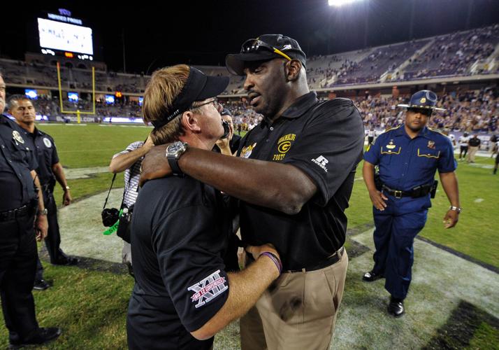 TCU Horned Frogs head coach Gary Patterson and Grambling State Tigers head coach Doug Williams meet after the game at Amon G. Carter Stadium.
