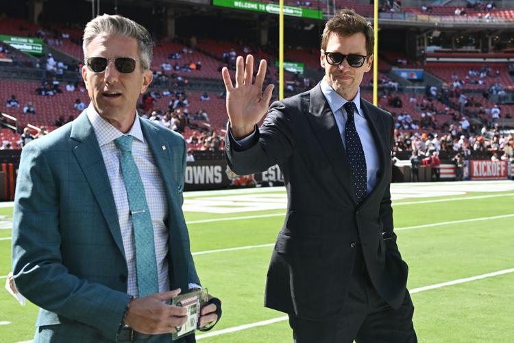 FOX Sports broadcaster Tom Brady greets fans before the game between the Cleveland Browns and the Dallas Cowboys at Huntington Bank Field in Cleveland.