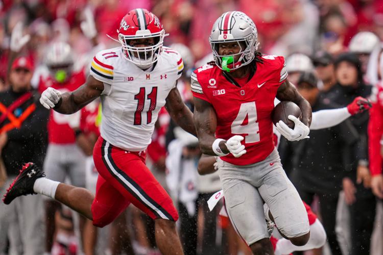 Ohio State Buckeyes wide receiver Jeremiah Smith (4) scores a touchdown past Maryland Terrapins defensive back Messiah Delhomme