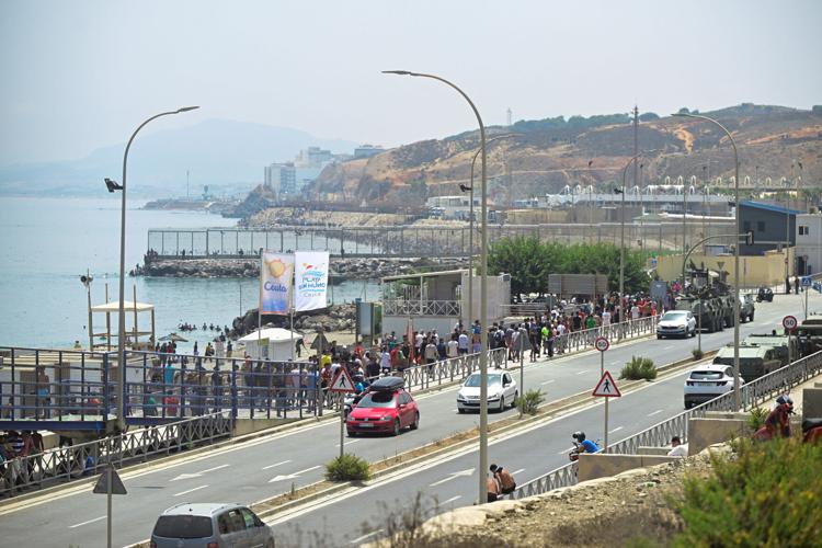 Migrants walk towards the border with Morocco to leave Spain, in Ceuta