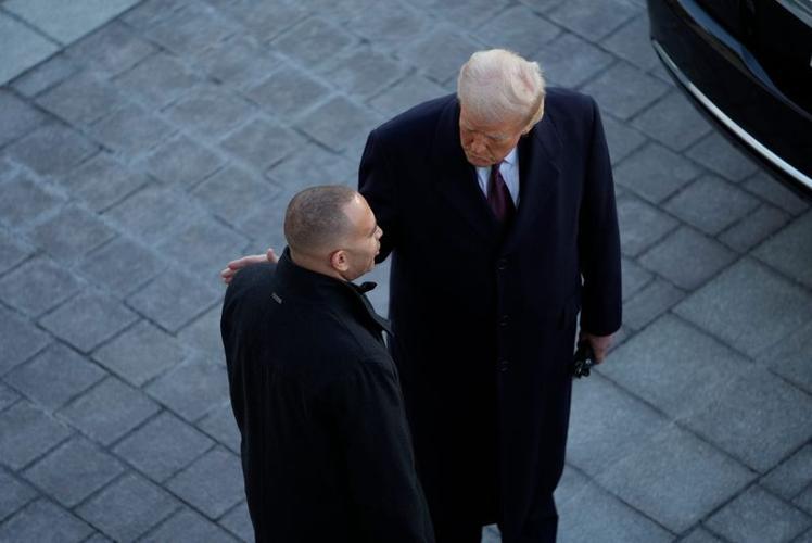 President Donald Trump speaks with House Minority Leader Hakeem Jeffries, D-New York, as he departs at the end of his inaugural ceremonies at the U.S. Capitol.