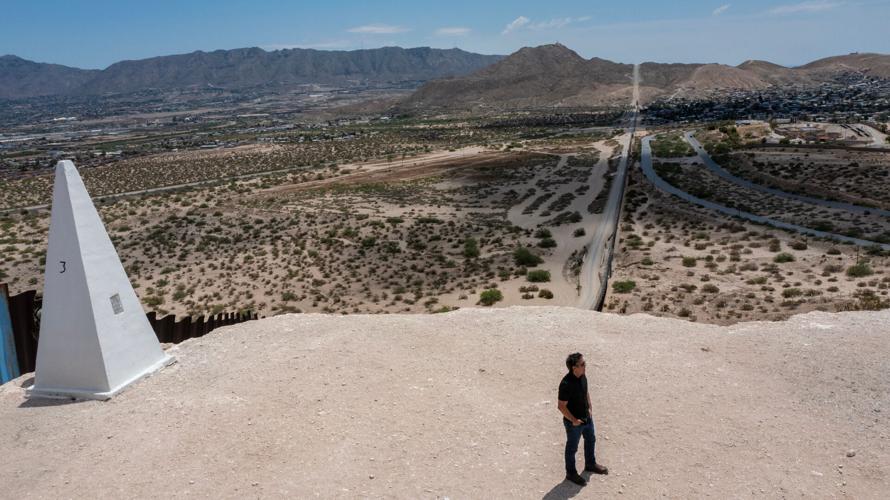 Nicholas Natividad looks across the U.S.-Mexico border between Ciudad Juárez and Sunland Park, N.M., in the Paso del Norte region. A descendant of families who lived through multiple shifts of the border, Natividad studies how generations of Mexican Ameri