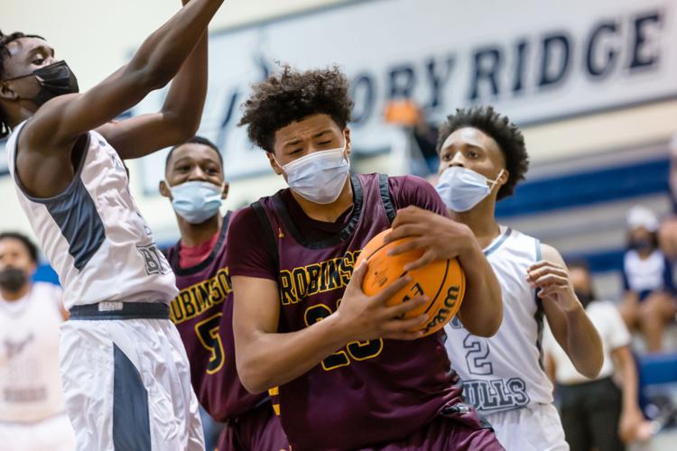 Boys Basketball: The Boys Jay M. Robinson Bulldogs defeated the Hickory Ridge RaginÕ Bulls 72-69 on Thursday night.