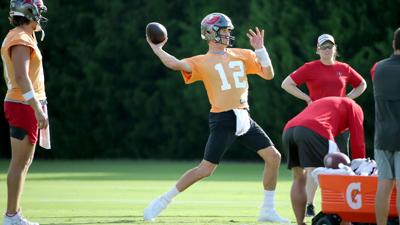 Tom Brady loads up a pass during Bucs training camp on Monday, August 2, 2021.
