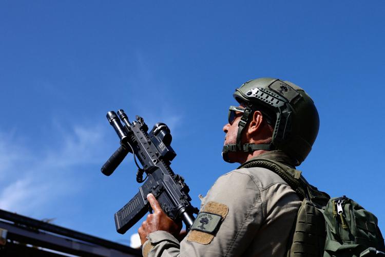 Israeli civilian response team searches for a hostile drone in Metula