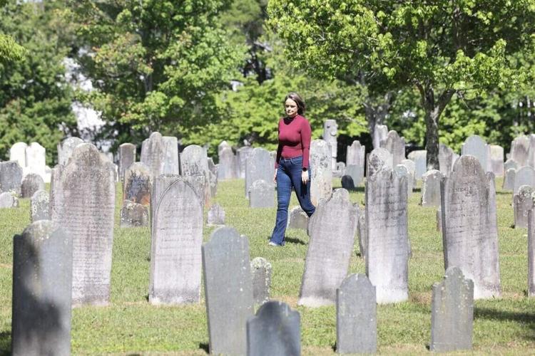 The Forgotten South blogger Kelly Gomez, shown at Steele Creek Presbyterian Cemetery in Charlotte, is working on a year-long project for the U.S. 250th anniversary visiting graves and sharing stories of people from the Revolutionary War.