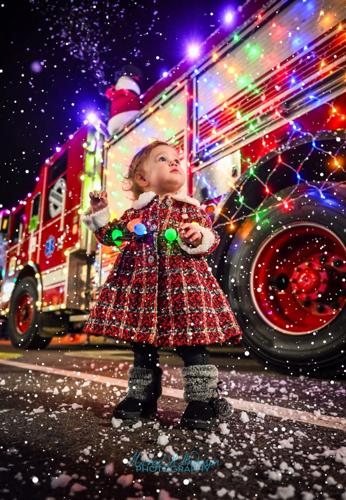 Little girl in front of fire truck