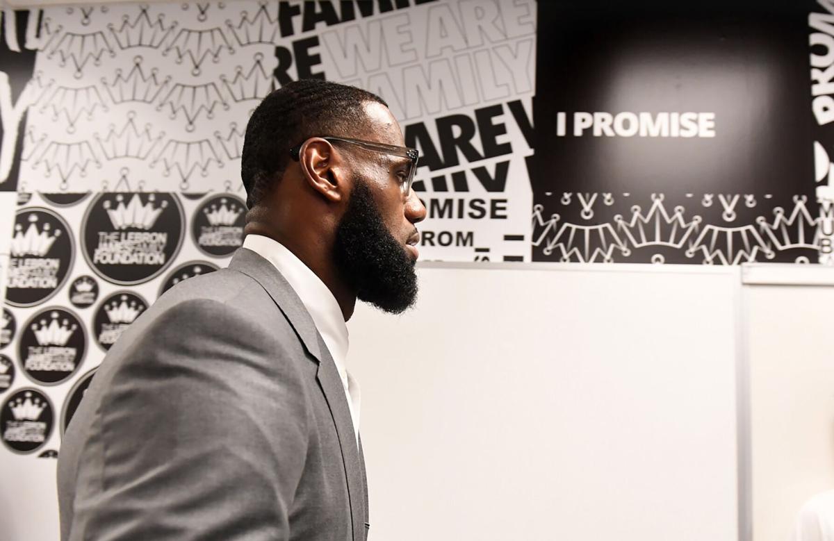 In this file photo, LeBron James prepares for a press conference in a classroom at the I PROMISE School in Akron, Ohio.