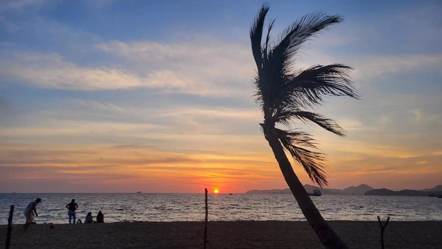 Sun sets over a Pacific beach in Manzanillo, the major port of Colima.