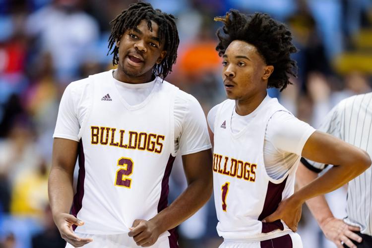 Image gallery from the 2021-22 NCHSAA Class 3A State Championship game between the Jay M. Robinson Bulldogs and the Farmville Central Jaguars at UNC Chapel HillÕs Dean E. Smith Center.  The Bulldogs defeated the Jaguars 70-68 to win the championship.